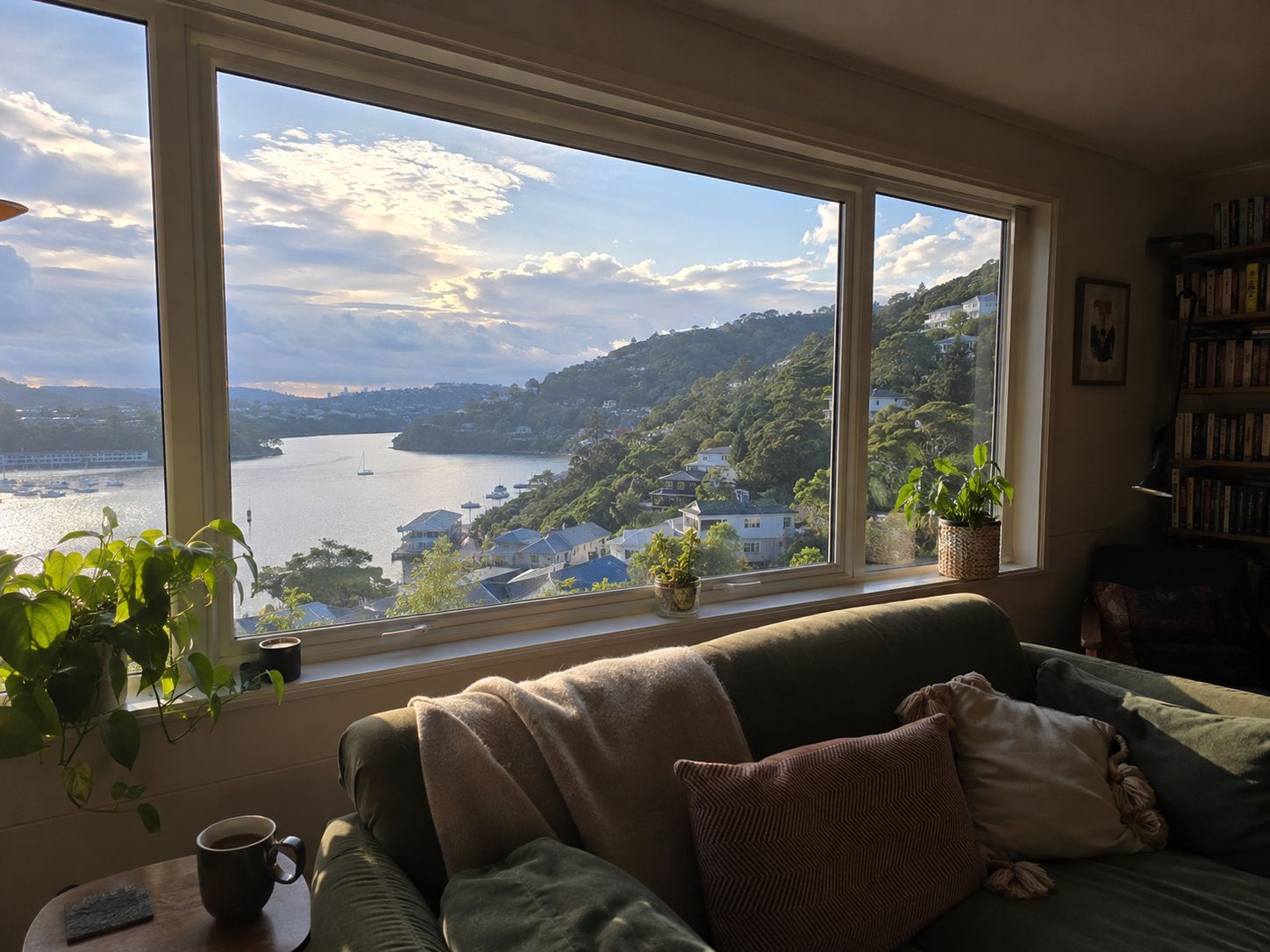 Warm Dunedin living room with new double glazing looking out over the harbour